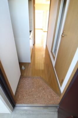 Entrance. Entrance is a little compact. Right hand door is the toilet.
