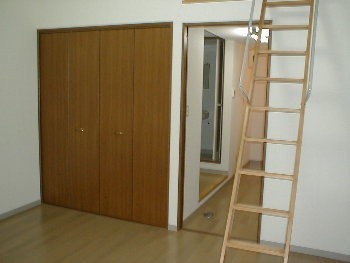 Living and room. There is a sliding door between the kitchen and the room