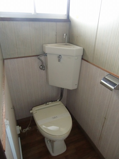 Toilet. It is bright and there is a window