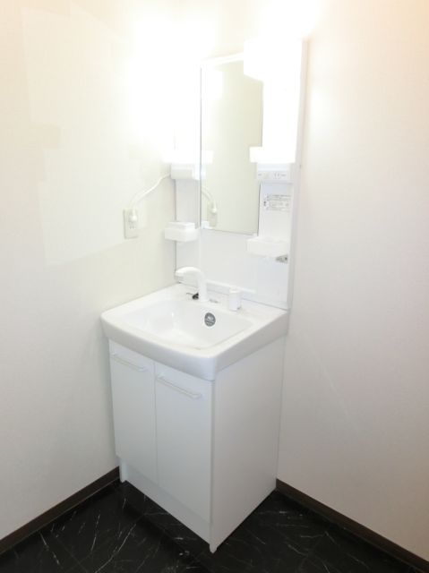 Washroom. Vanity with excellent functionality. 