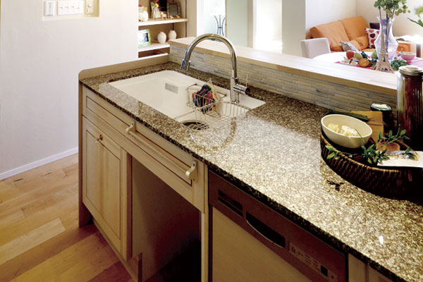 Kitchen.  [Top board] Kitchen top plate use a natural stone. It goes well with the texture of the wood