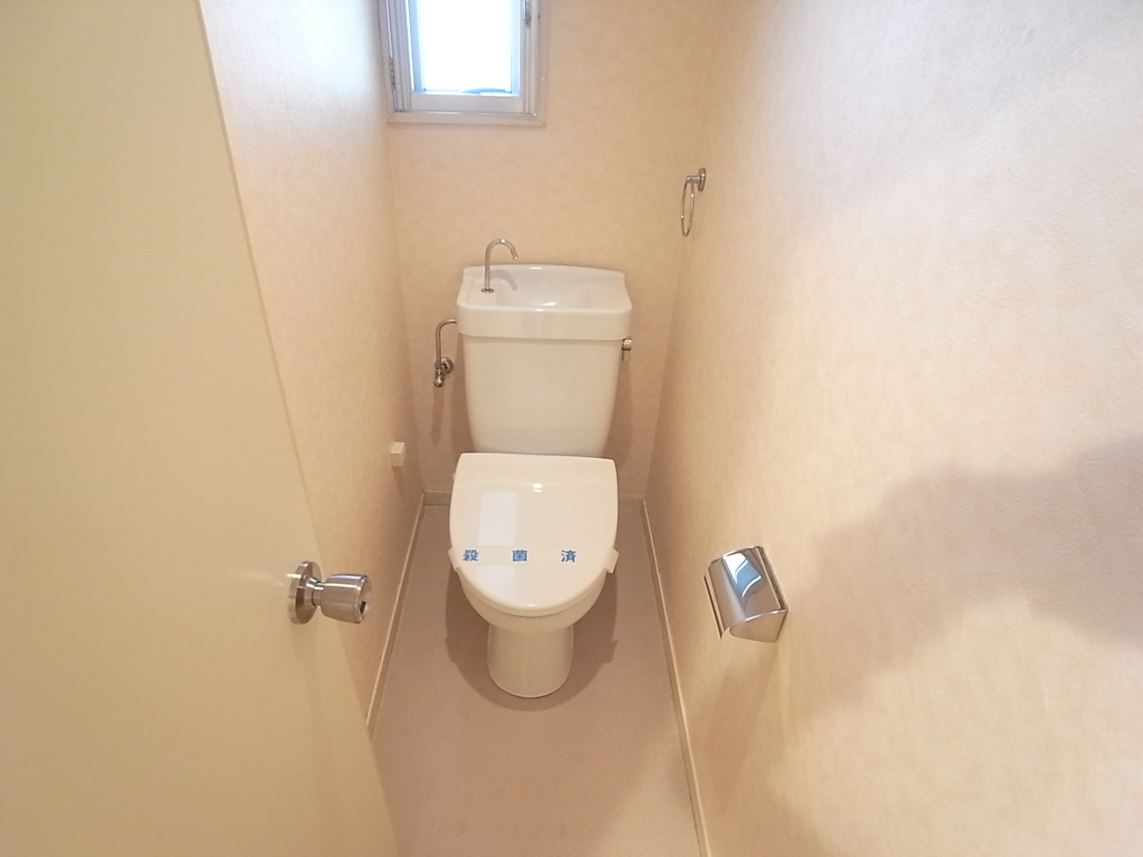 Toilet. There is a window, Ventilation is easy to toilet