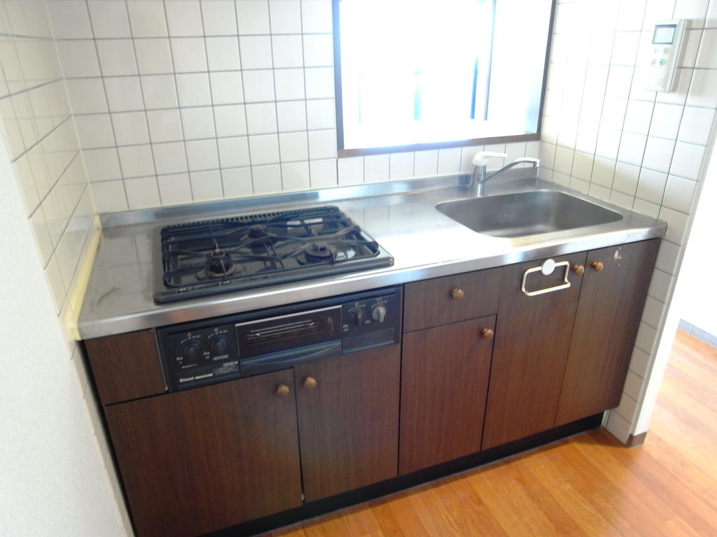 Kitchen. It is a kitchen with a gas stove. 