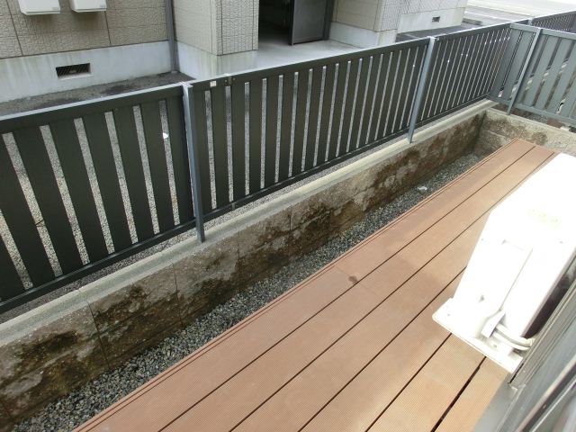 Garden. Simple wood deck there