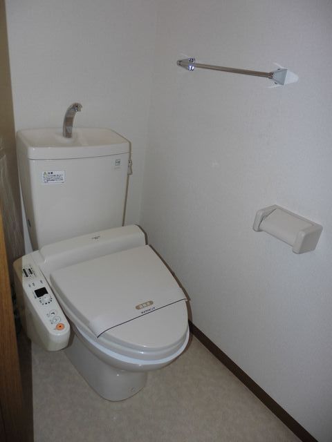 Toilet. It is there and happy warm water washing toilet seat