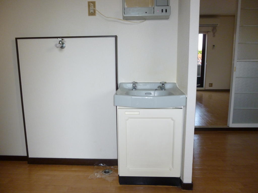 Washroom. Cute wash basin in white and pale blue color. 