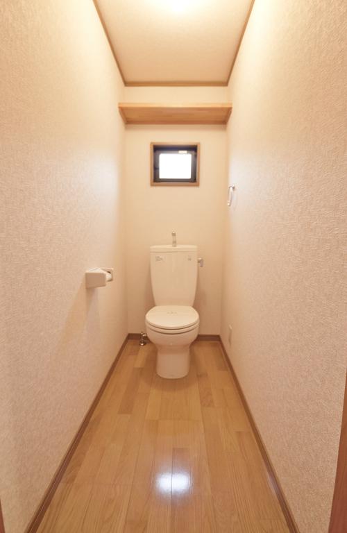Toilet. Wide toilet with a window