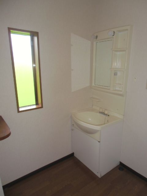 Washroom. There is a small window. Basin space of spread