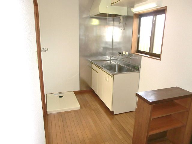 Kitchen. Also equipped with washing machine inside the yard. 