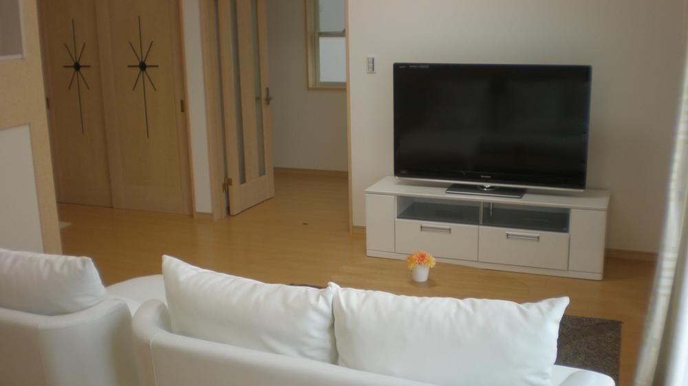 Living. Large TV also also comes with a sofa! 