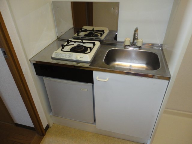 Kitchen. It comes with a gas stove. 