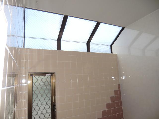 Bathroom. It is bright in the bathroom because there is a window to the top of the bathroom
