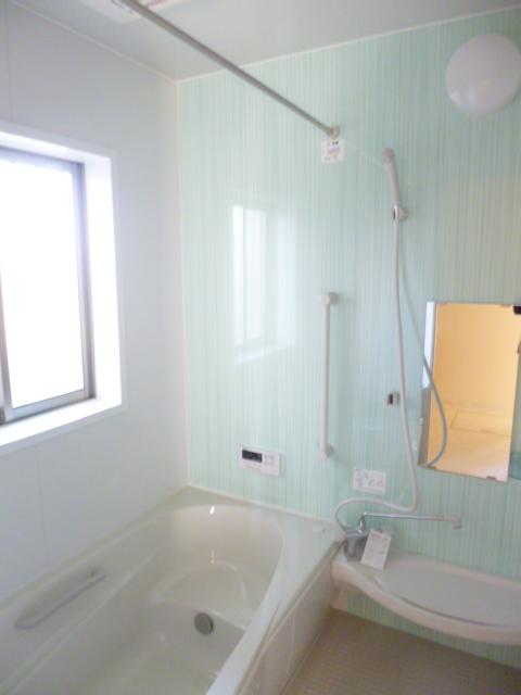 Bathroom. Walls are pastel green. Please slowly heal fatigue of the day. 