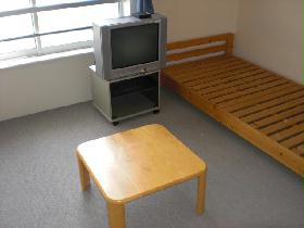 Living and room. tv set, Bed, It is with table