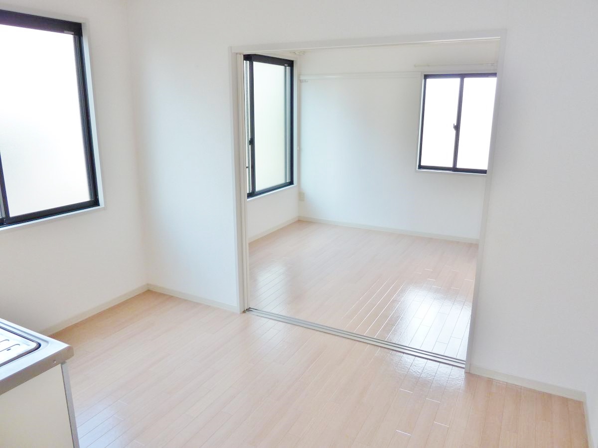 Other room space. Kitchen is put well as open and cupboards. 