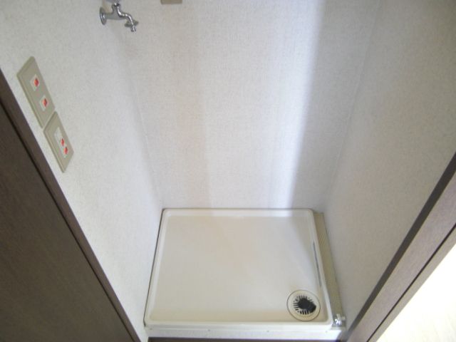 Washroom. It is indoor washing machine Storage. 