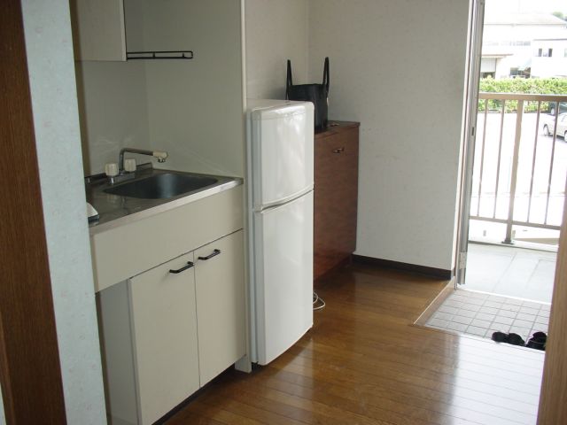 Kitchen. It comes with a refrigerator. 