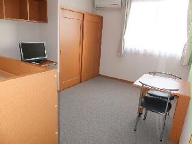 Living and room. It is a photograph that was taken from the room entrance