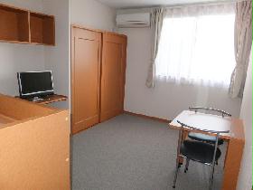 Living and room. It is a photograph that was taken from the room entrance