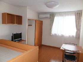 Living and room. It is a photograph that was taken from the room entrance