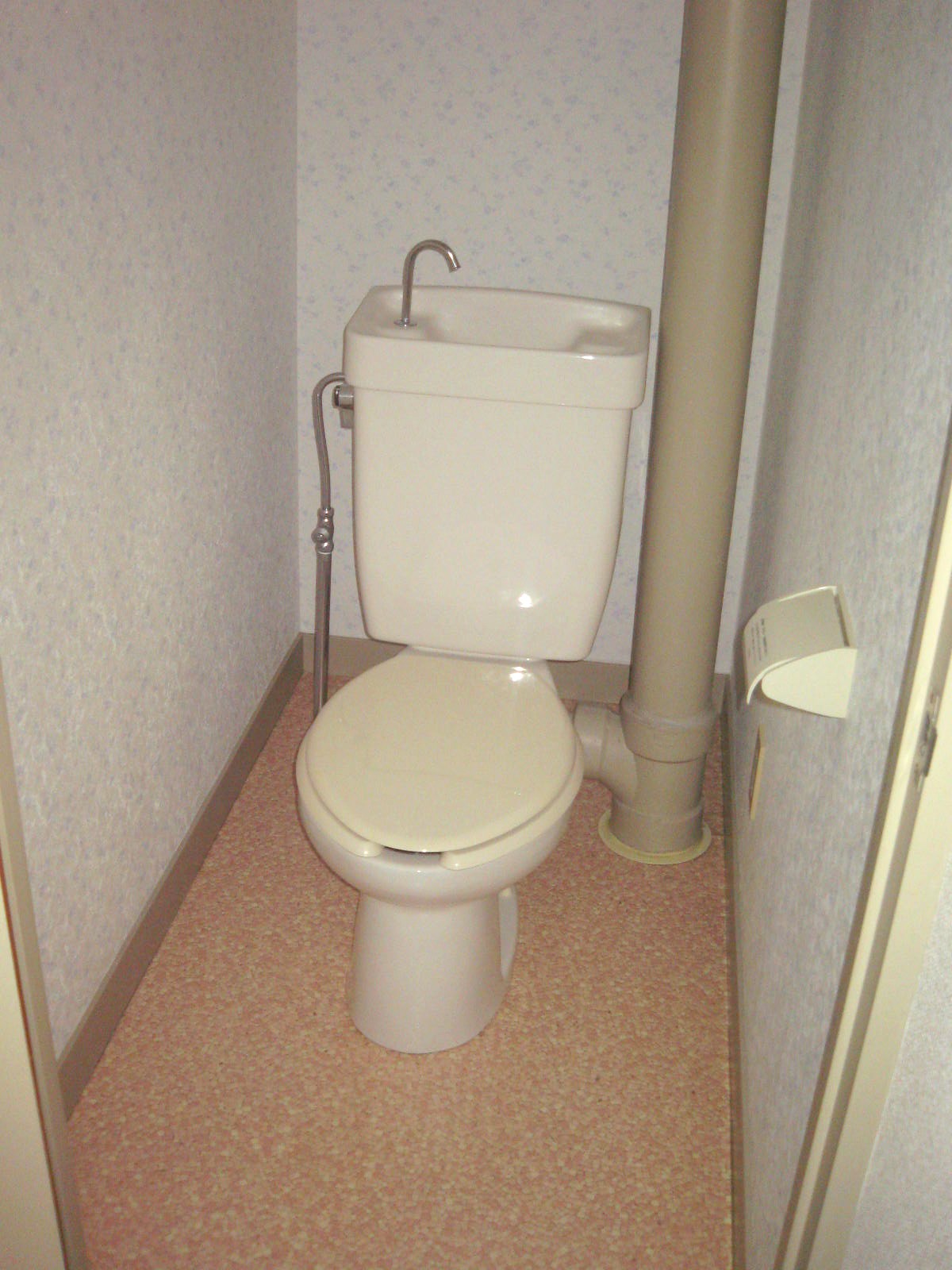 Toilet. It will be warm water washing toilet seat.