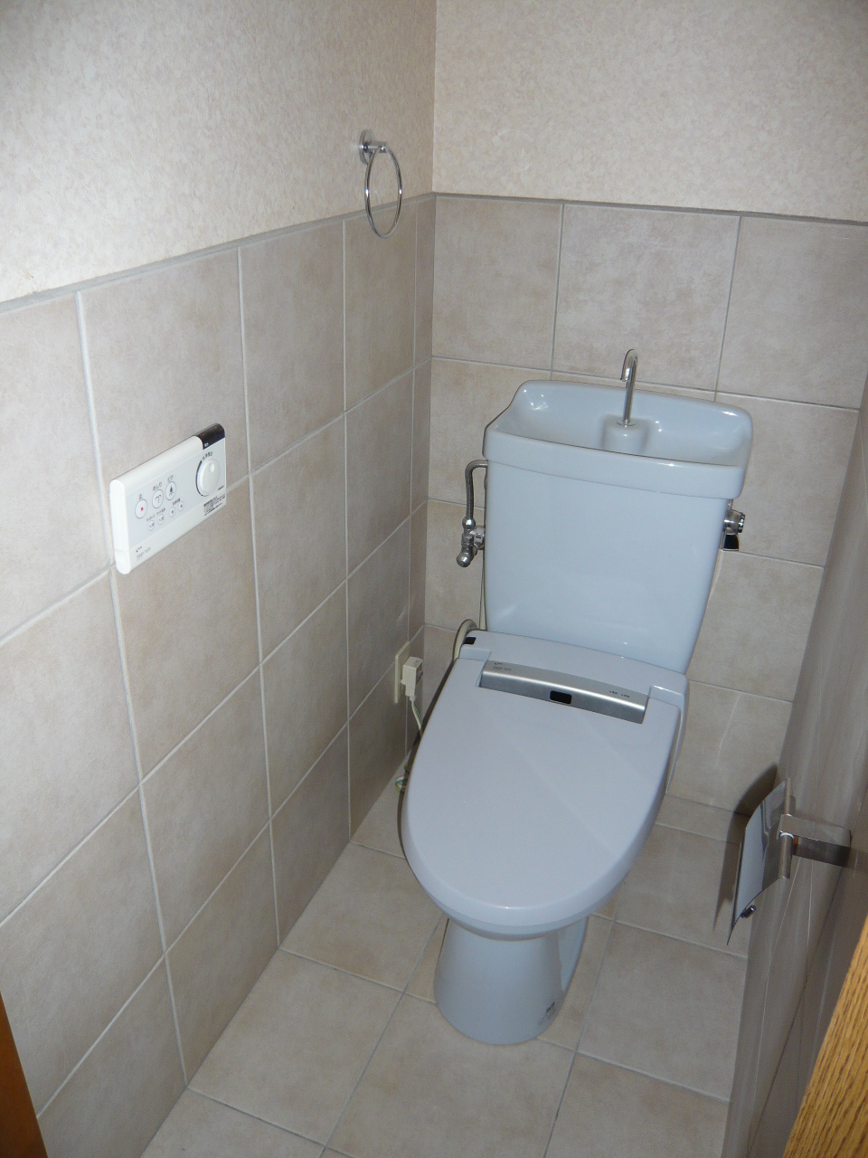 Toilet. It is the bidet of wall switch! 