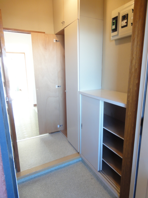 Entrance. Cupboard and storage shelves with the entrance