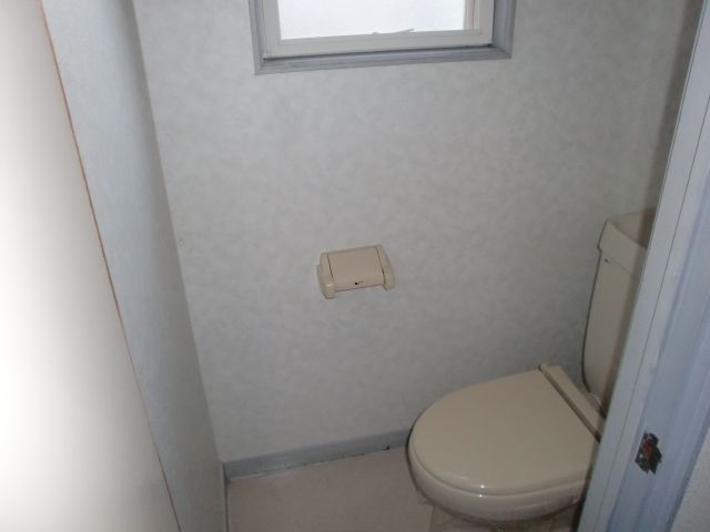 Toilet. Toilet with a small window. Useful for ventilation. 