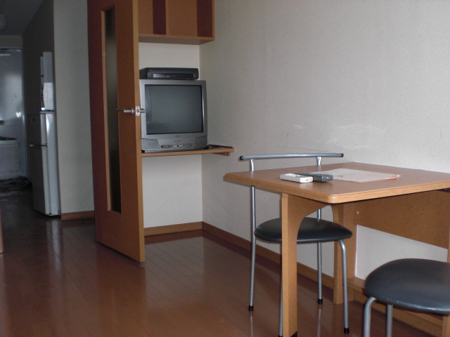 Living and room. Folding table and two chairs