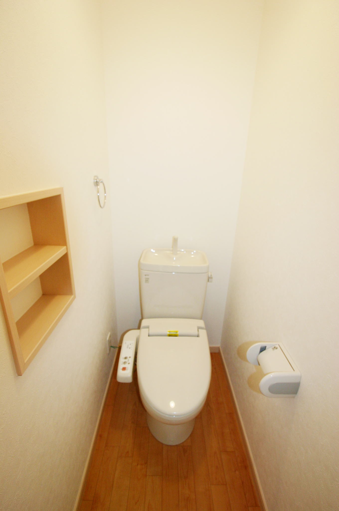 Toilet. Shower toilet. The wall comes with a shelf. 