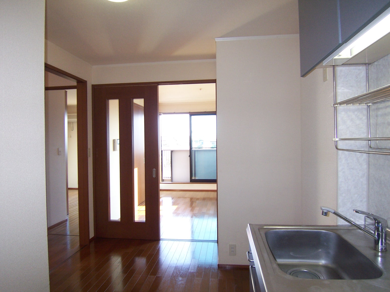 Kitchen. See the living room from the kitchen side. 