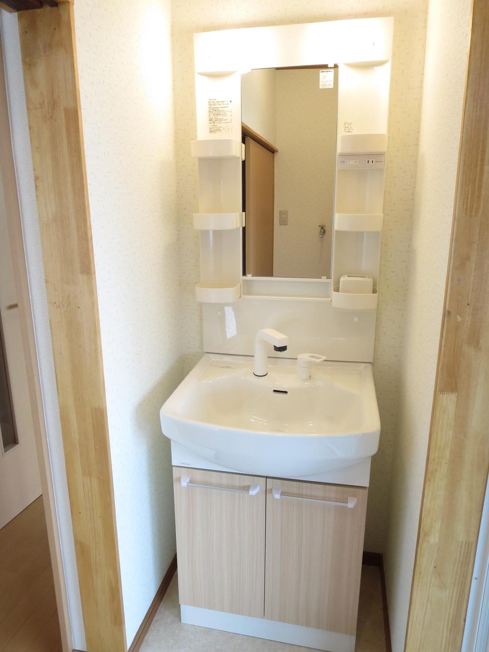 Wash basin, toilet. Vanity with a shower head is also useful in the morning Shan