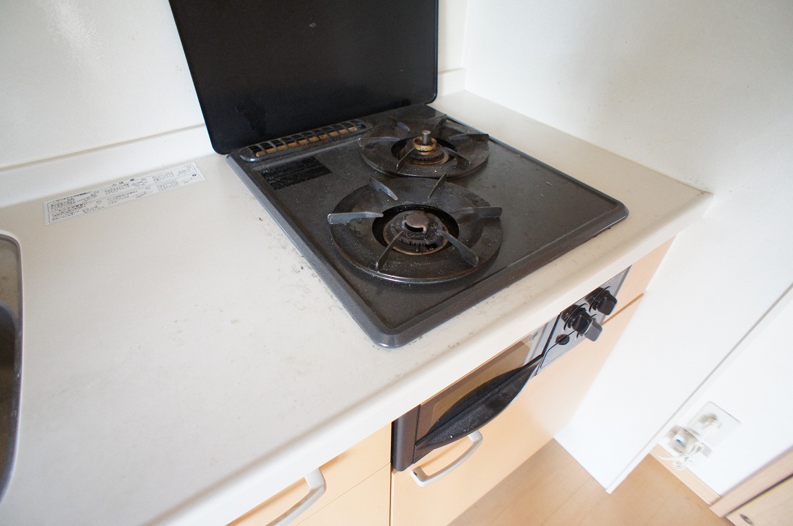 Kitchen. With a two-burner stove and grill.