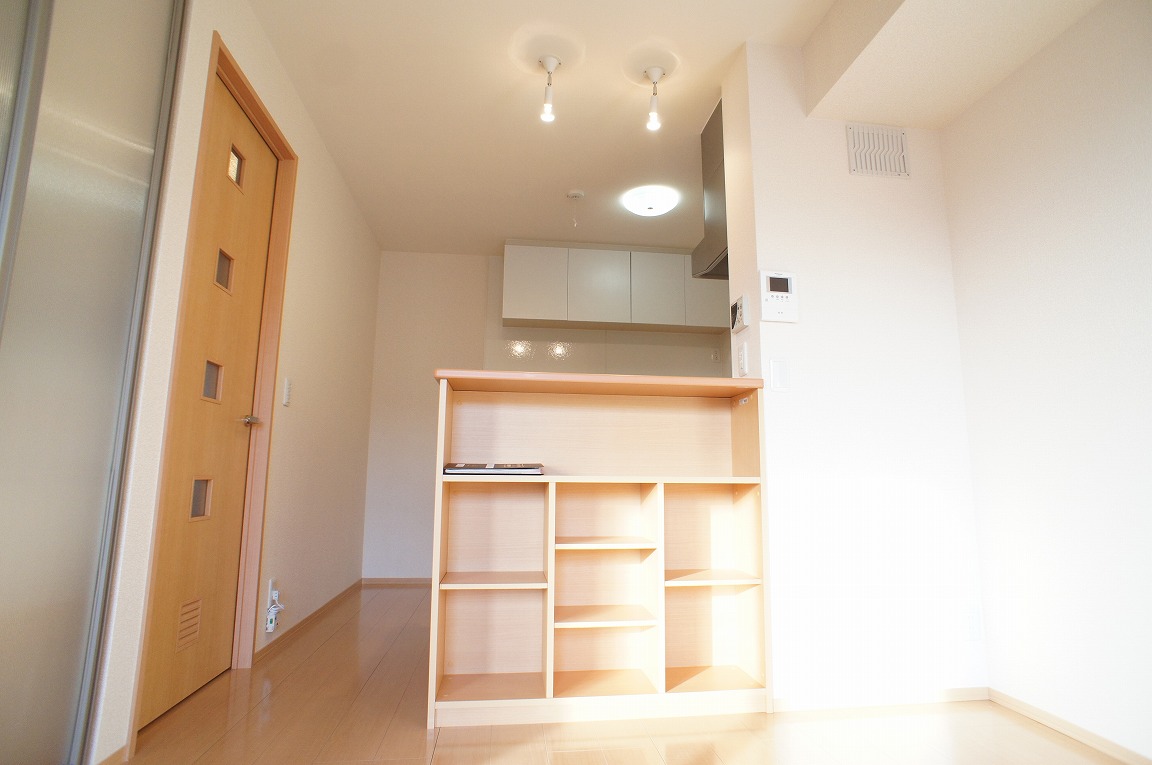 Living and room. Kitchen counter with storage.