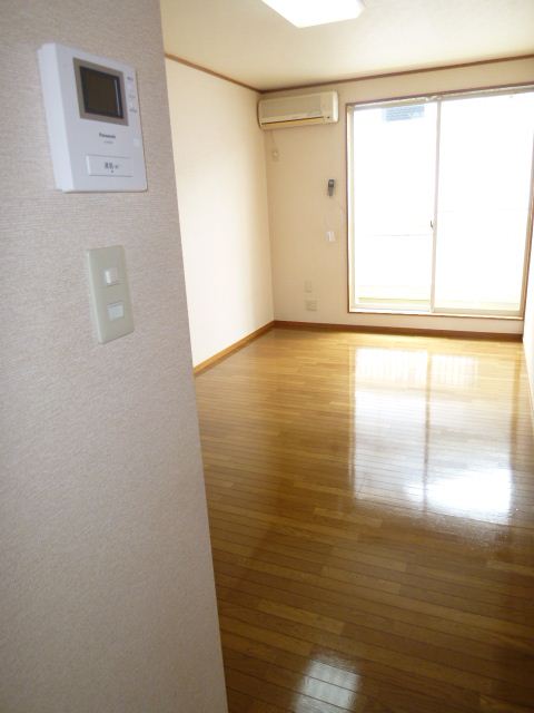 Living and room. Spacious is 8 quires of flooring. 