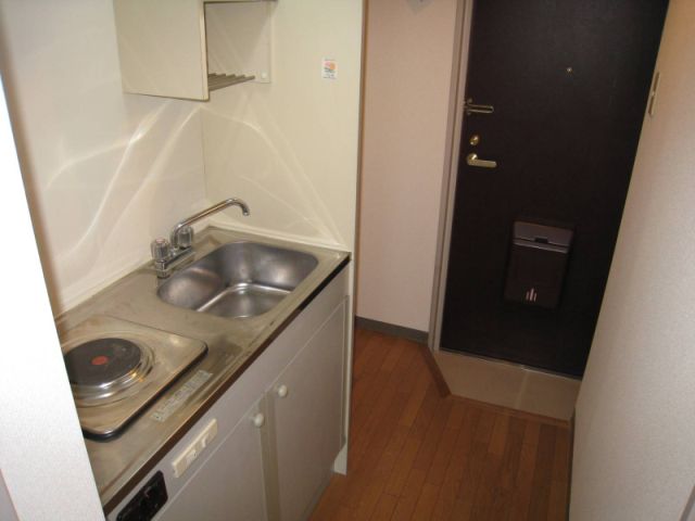 Kitchen. It is with an electric stove.