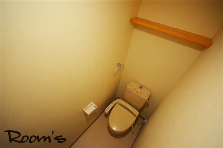 Toilet. Washlet toilet. There is a shelf at the top. 