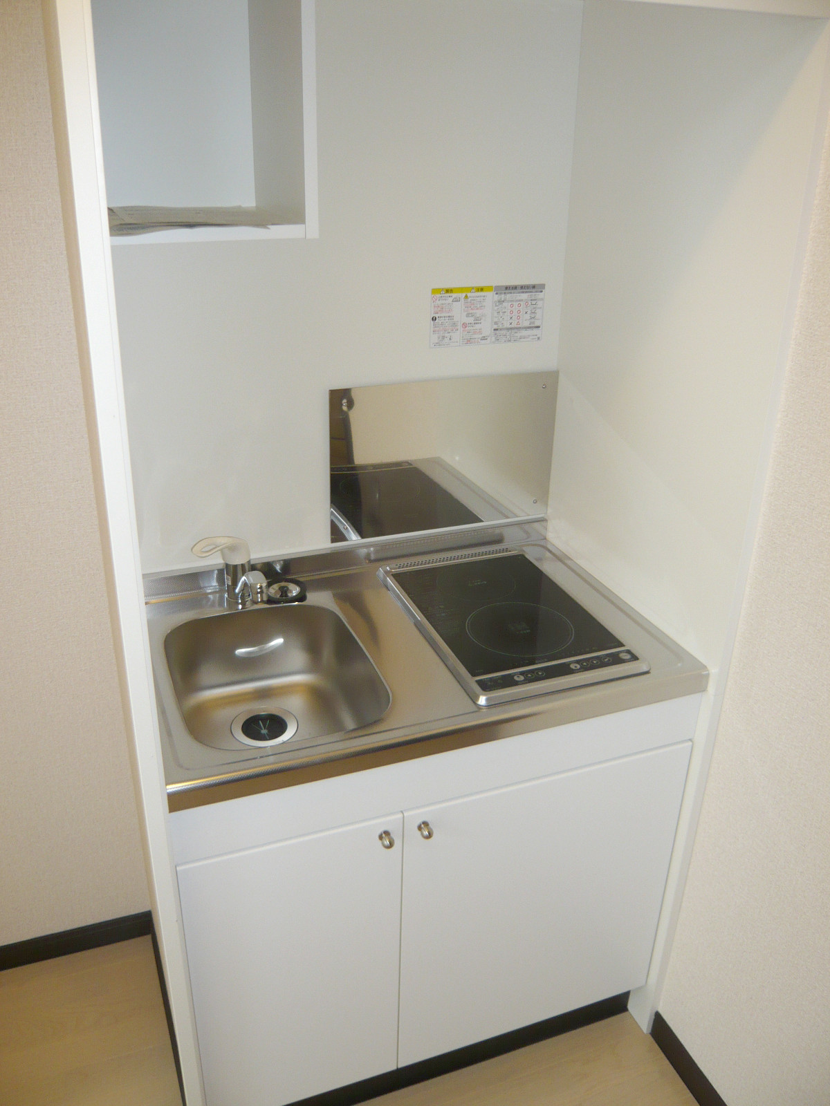 Kitchen. Two-burner stove with kitchen. This is sufficient if living alone.