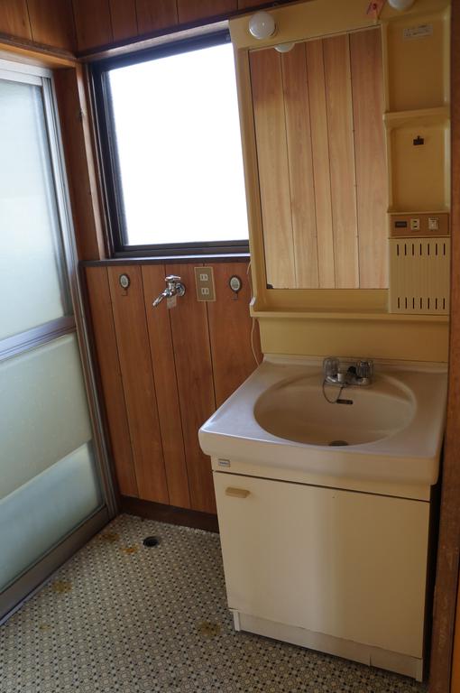 Washroom. It is with wash basin! There is storage room washing machine! 