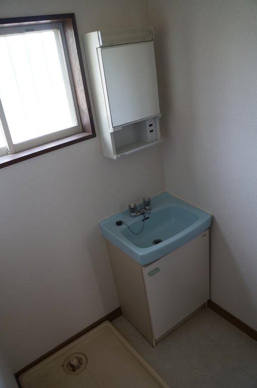 Washroom. It is bright with a window! With in-room washing machine storage! 