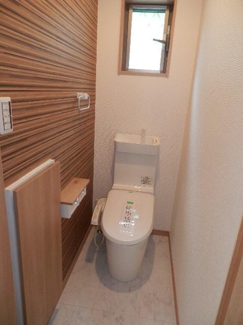 Toilet. Bidet and a human sensor exhaust fan toilet, Also comes with storage.