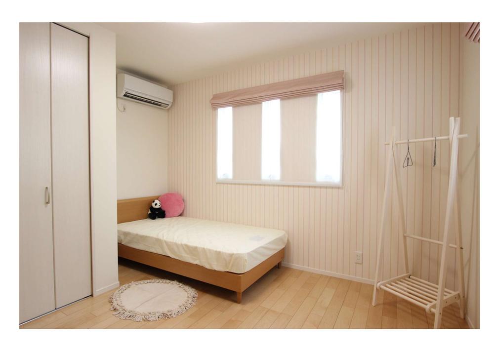 Non-living room. Is a children room with the image of a girl in the room. 