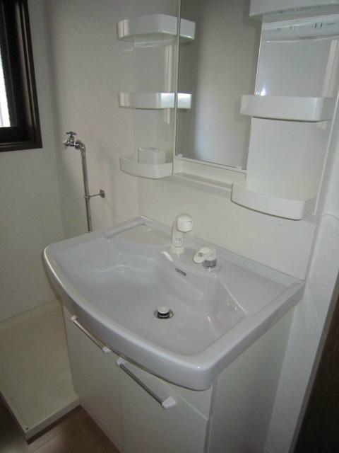 Wash basin, toilet. Vanity is vanity shower