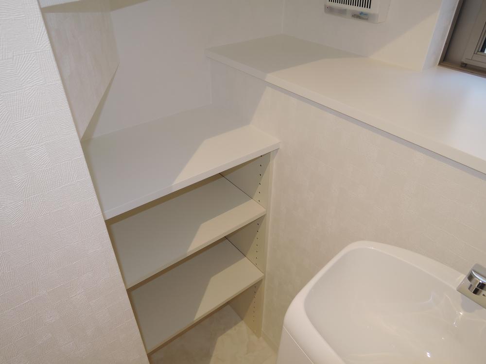 Toilet. There is something useful storage space to the toilet! 