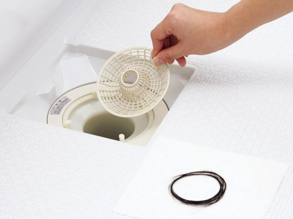 Bathing-wash room.  [Hair catcher with handle (bathroom)] The drainage port of the bathroom, It employs a filter that was less likely to tangle the hair in its own structure. It will get rid of easily by flipping the filter hair accumulated in the drain outlet. (Same specifications)