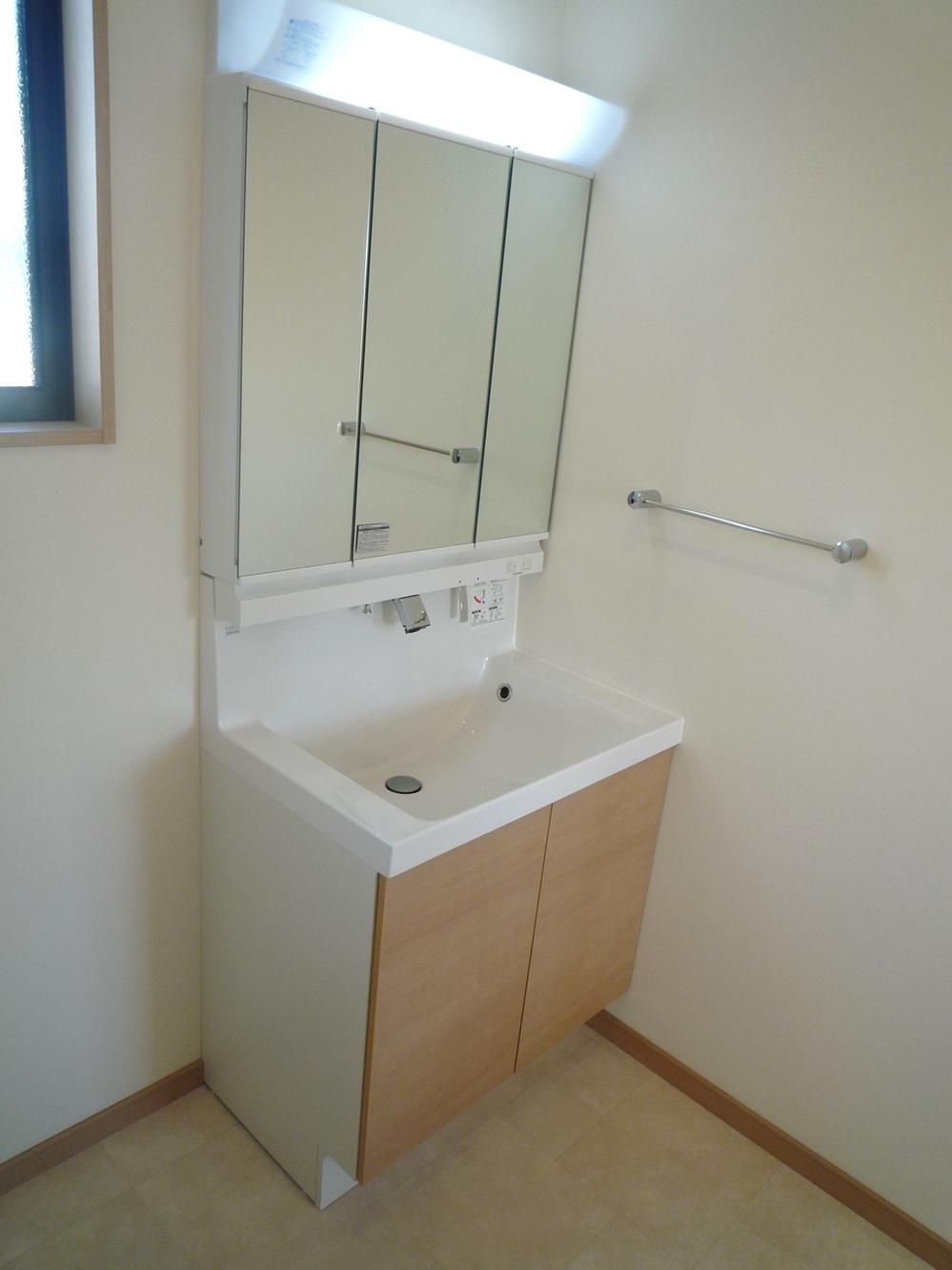 Wash basin, toilet. Full of clean washroom. 