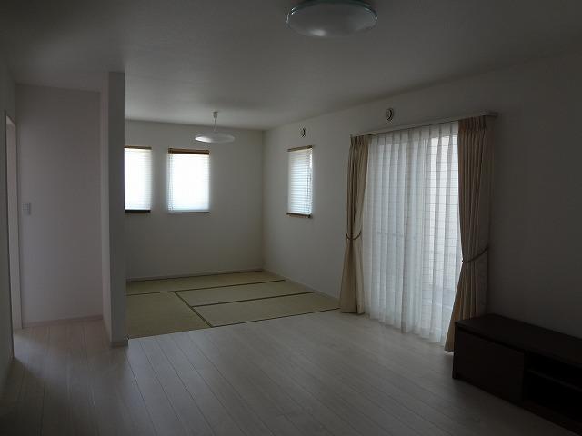 Living. Spacious because it connected to the Japanese-style room