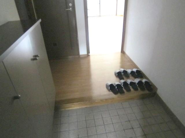 Entrance. Footwear is a foyer with a purse