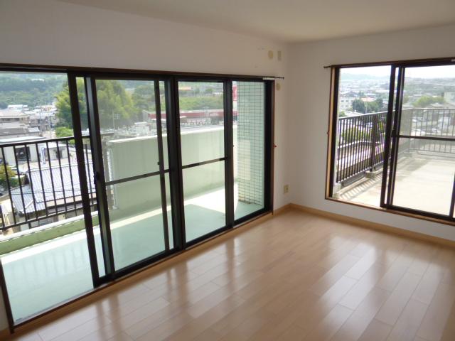 Living. Bright living room surrounded by a balcony