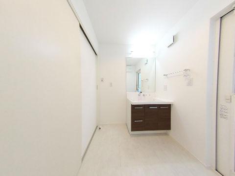 Wash basin, toilet. It is the washroom